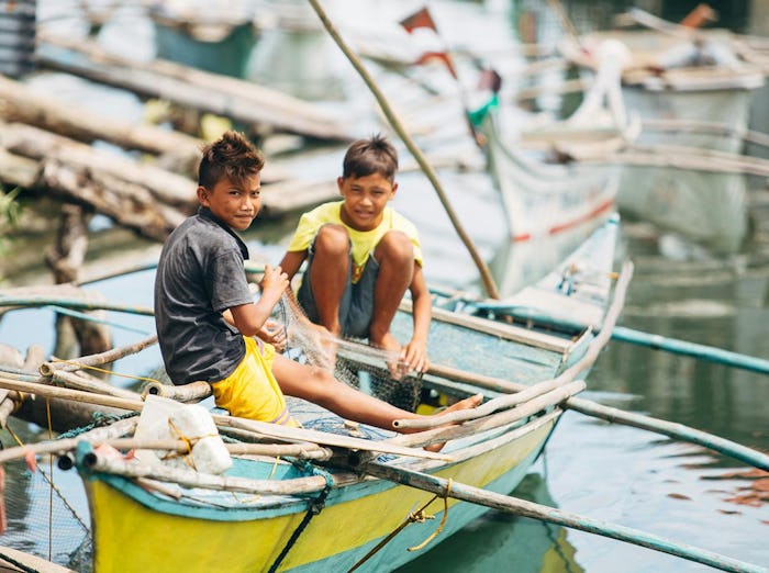 kids on boat in the philippines
